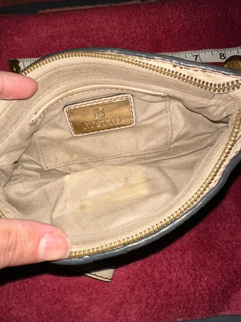 Cream Leather Wristlet Clutch with Gold Medallion Accent